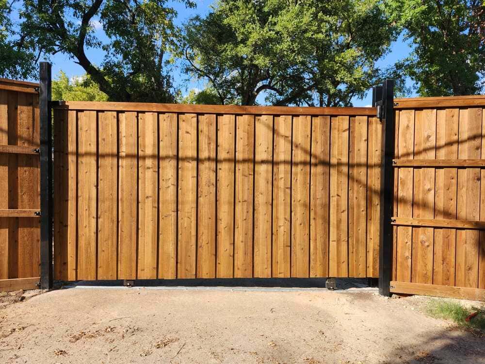 Cedar driveway gate on a welded steel frame, built for automation
