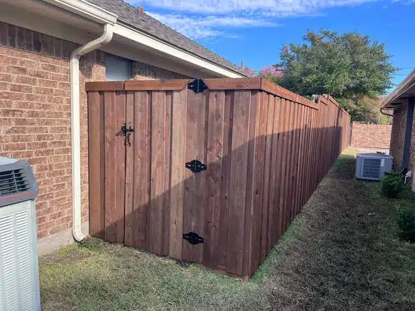 Custom wood gate installed in a new cedar fence by DFW Top Fence